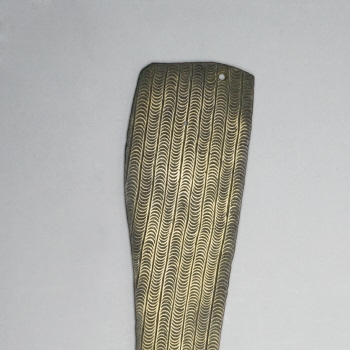 Monumental brass fragment